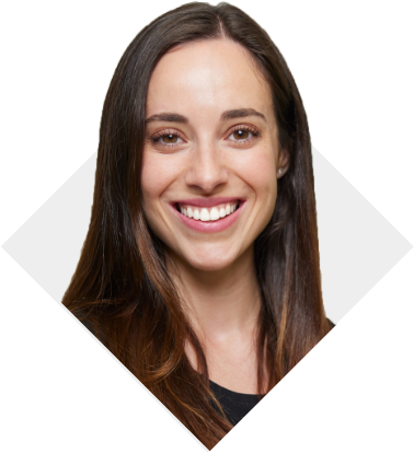 A woman with light brown straight hair smiling and wearing a black shirt